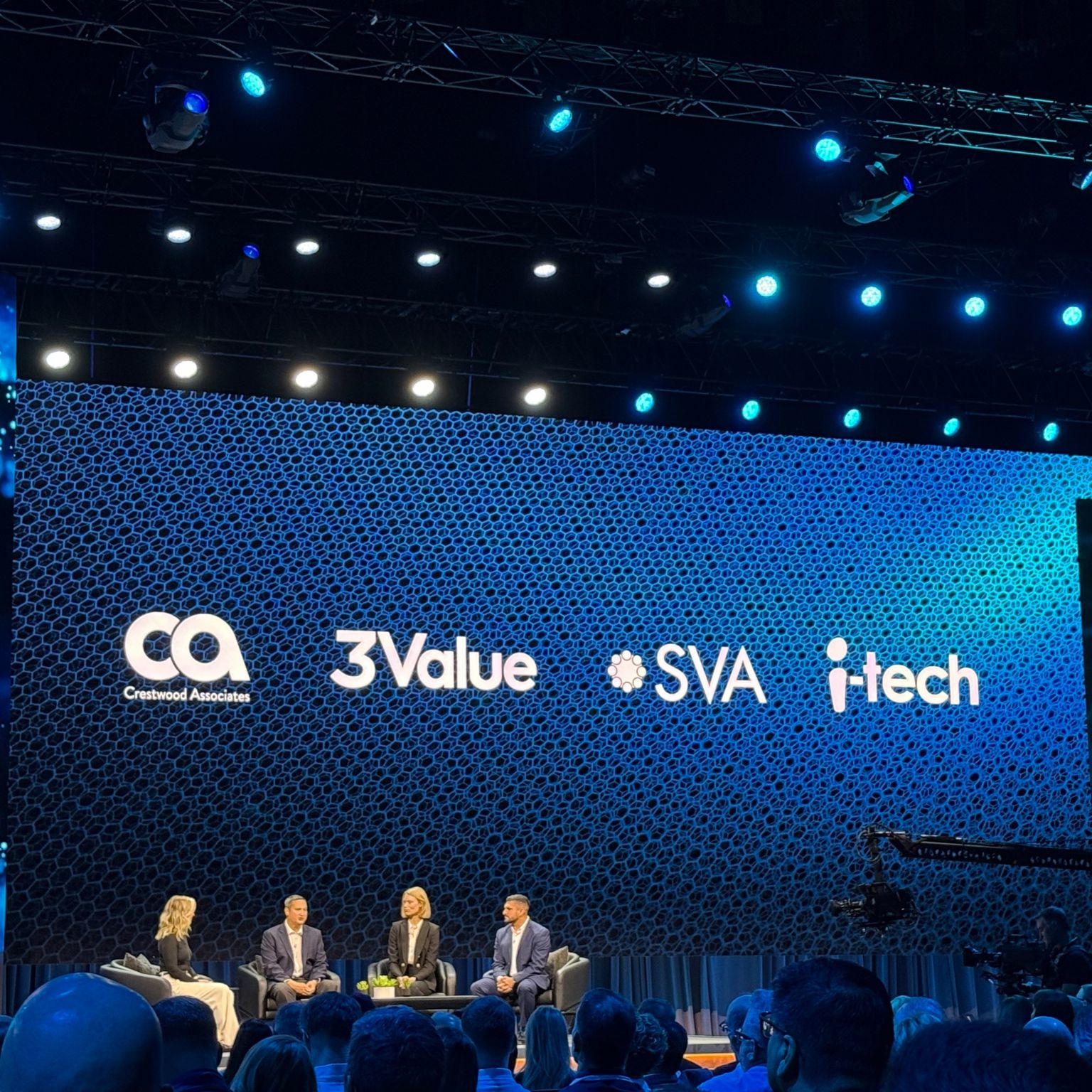 people on stage at conference