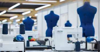 factory with sewing machines and mannequins for fashion modeling 